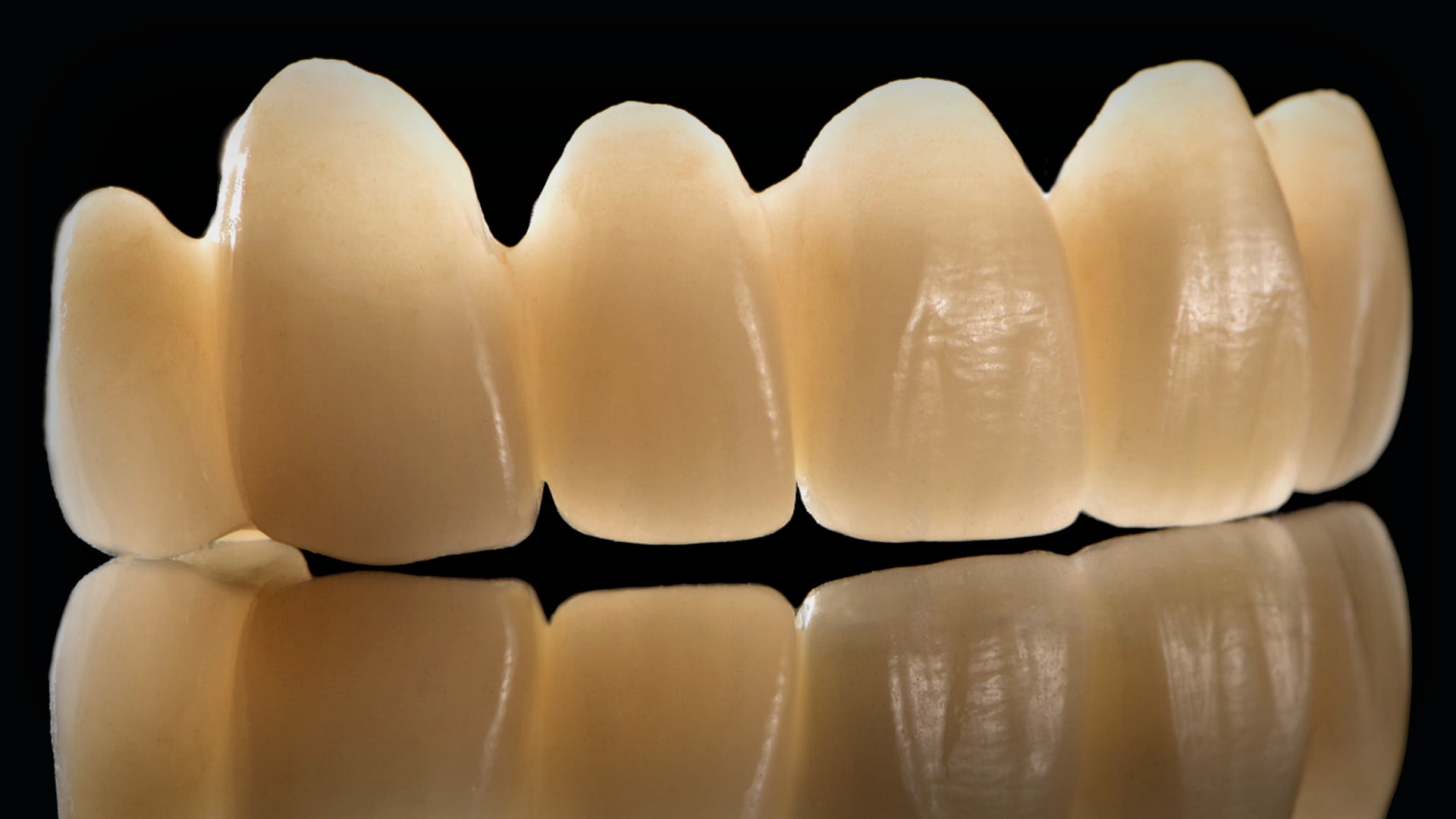 Premium dental laboratory atelier image with realistic zirconia prosthetic work and Magic Smile Design brand context